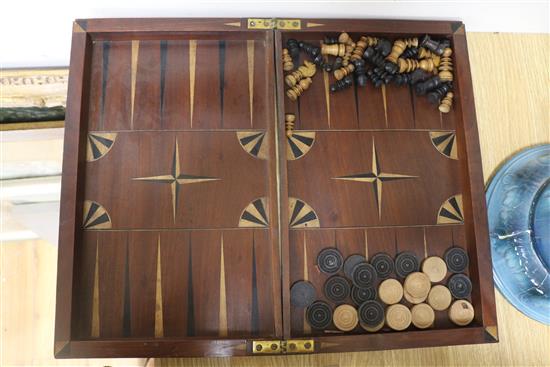 A Victorian chess board, with chess set, dominos and chequers